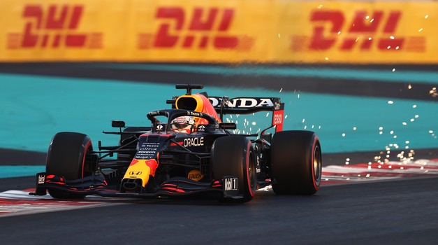 ABU DHABI, UNITED ARAB EMIRATES - DECEMBER 12: Race winner and 2021 F1 World Drivers Champion Max Verstappen of Netherlands and Red Bull Racing celebrates with his father Jos Verstappen in parc ferme during the F1 Grand Prix of Abu Dhabi at Yas Marina Circuit on December 12, 2021 in Abu Dhabi, United Arab Emirates. (Photo by Mark Thompson/Getty Images)
