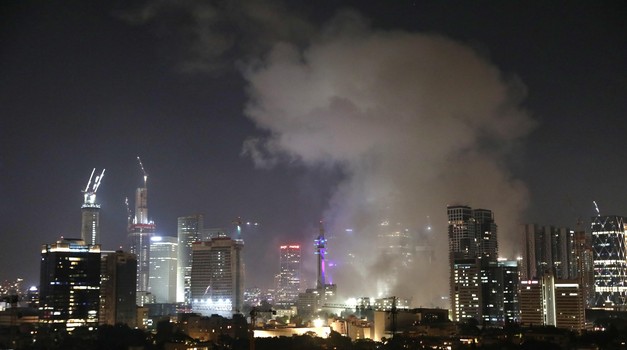 TEL AVIV, June 13, 2025 (Xinhua) -- Smoke rises following an Iranian missile attack in Tel Aviv, Israel, on June 13, 2025. Dozens of missiles were fired from Iran into Israel on Friday evening, according to statements issued by the Israel Defense Forces (IDF). (Gideon Markowicz/JINI via Xinhua) Photo: GIDEON MARKOWICZ/XINHUA